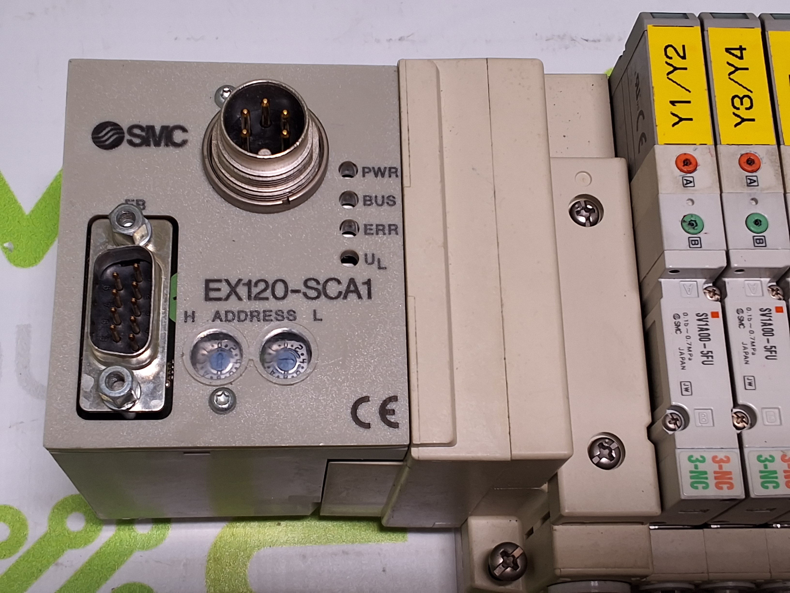 Used SMC EX120-SCA1 CONTROLLER AND 5 PORT MANIFOLD WITH 7 SMC SOLENOID VALVES