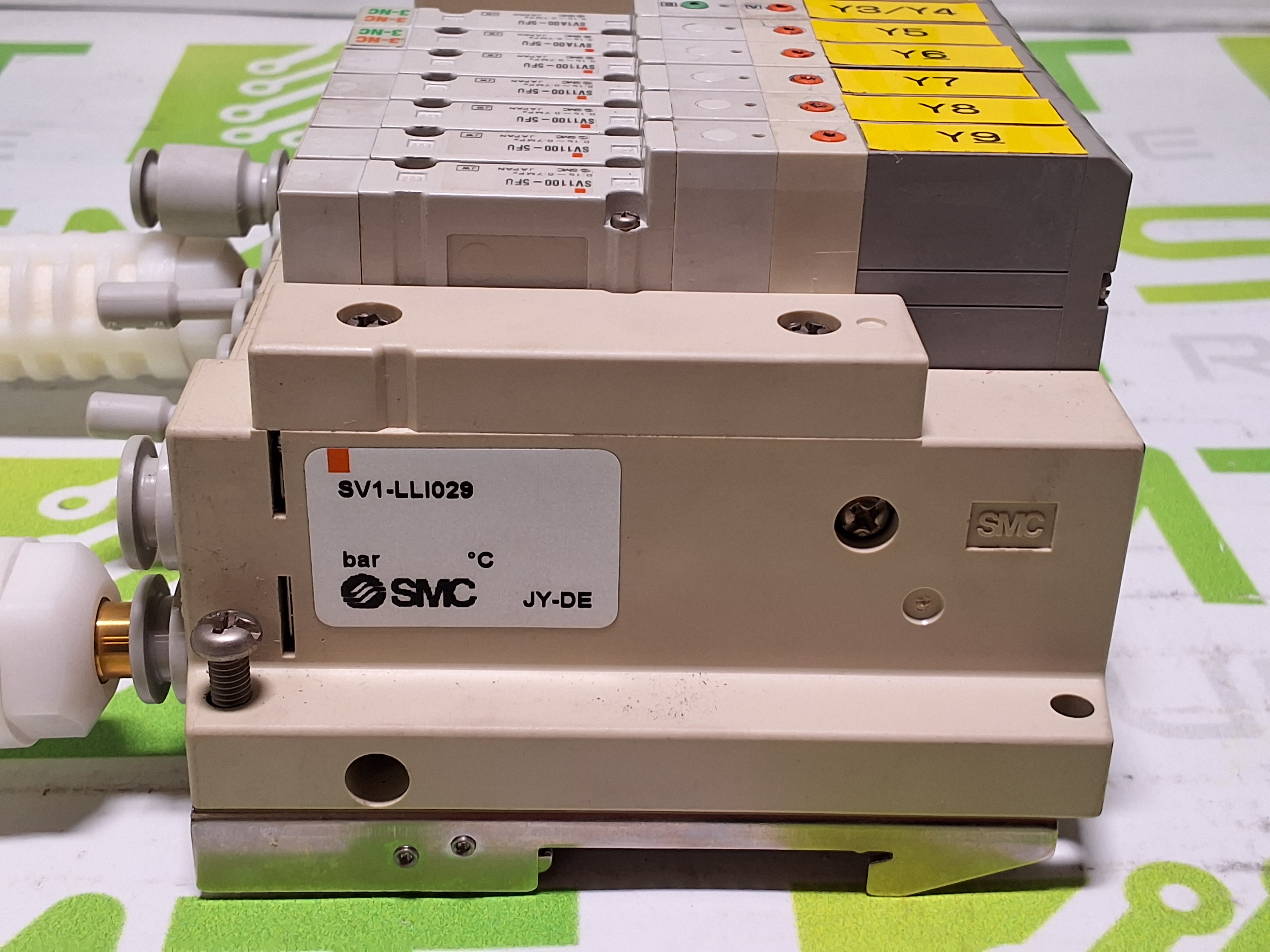 Used SMC EX120-SCA1 CONTROLLER AND 5 PORT MANIFOLD WITH 7 SMC SOLENOID VALVES