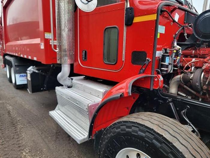 Used "BIG RED" 2015 PETERBILT REAR LOAD TRUCK