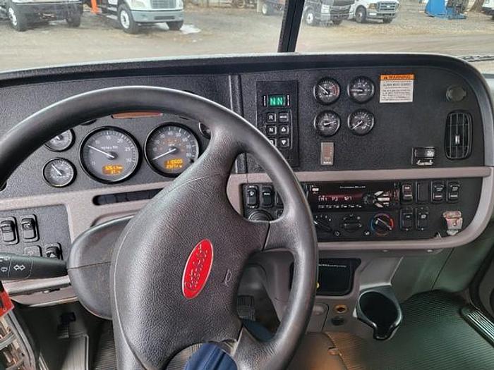 Used "BIG RED" 2015 PETERBILT REAR LOAD TRUCK