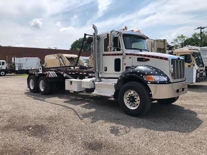 Used 2015 PETERBILT ROLLOFF TRUCK