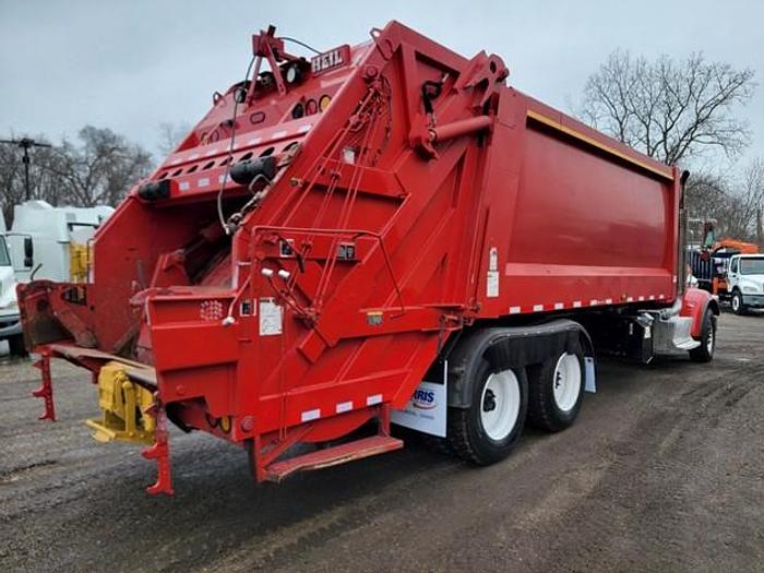 Used "BIG RED" 2015 PETERBILT REAR LOAD TRUCK