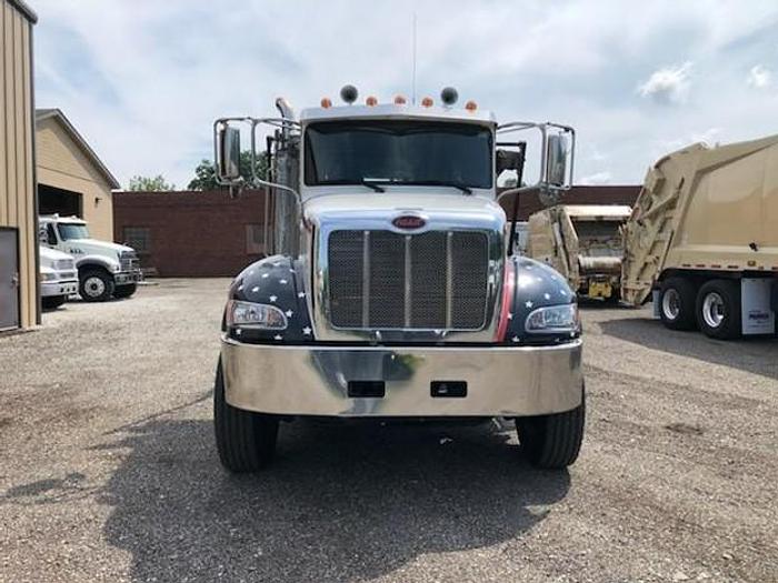 Used 2015 PETERBILT ROLLOFF TRUCK
