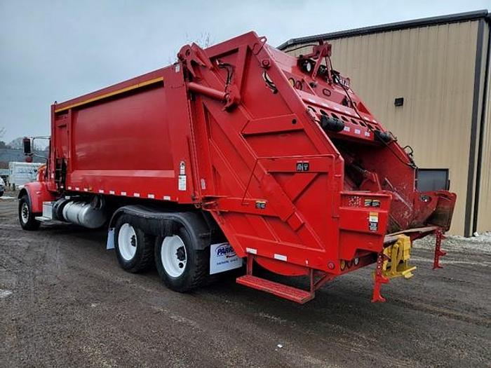 Used "BIG RED" 2015 PETERBILT REAR LOAD TRUCK