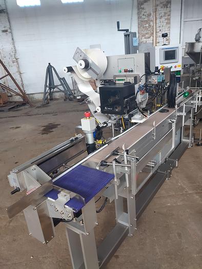 Used Lsi  Mdl 20 -627b  pressure sensitive top labeler with 8 foot  conveyor