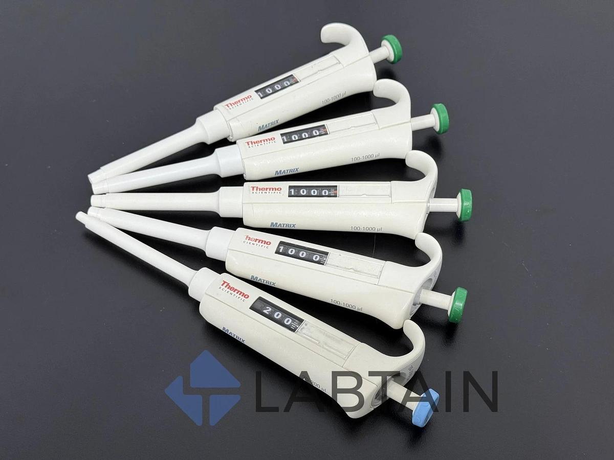 Used Thermo Scientific Matrix Adjustable Pipetts - 20-200ul (1) and 100-1000ul (4)