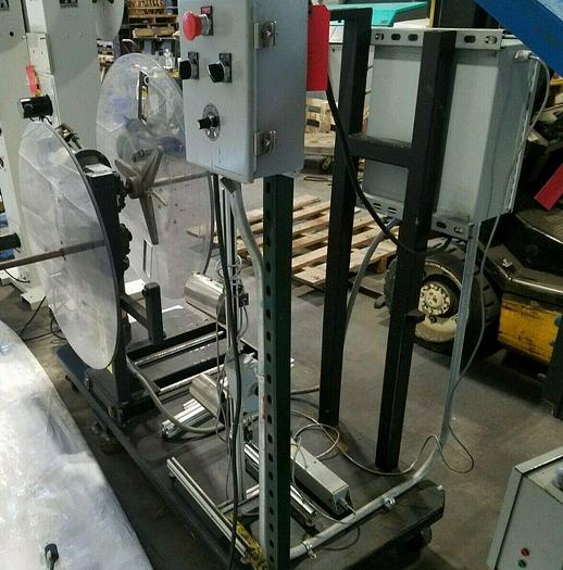 Used Rapid Motorized Double Sided Stock Reel Material Feed with control panel