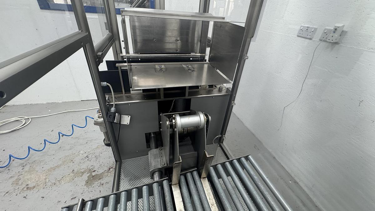 Used Marchesini PS300 semi-auto case packer – fully enclosed version