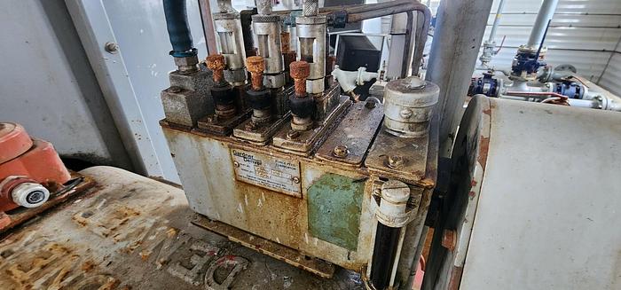Used Water Injection Building c/w (2) Garner Denver 200 TDE 001 Triplex pumps