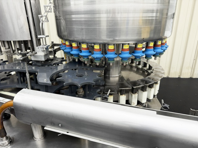 Used Filler Specialties 30/10 Mono-Block Bottle Filler-Capper with Waterfall Style Cap Sorter-Feeder