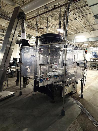 Used Packaging Dynamics 40 Valve Rotary Liquid Bottle Filler with DTM 12 Head Capper