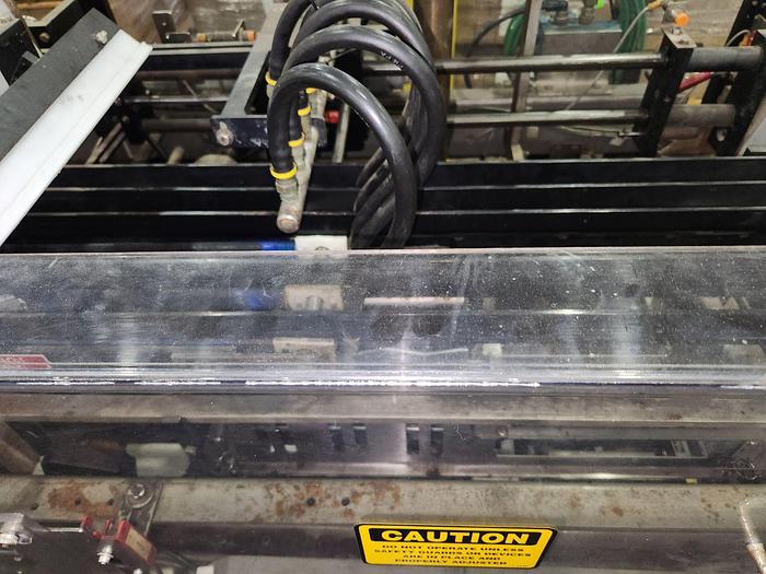 Used HARTNESS CASE PACKER with Laner Infeed, Model 900AT