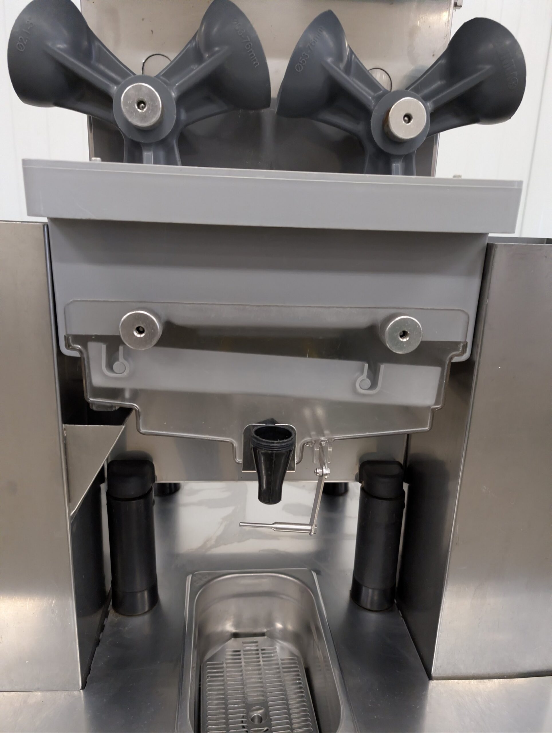 Used Zummo automatic orange juicer on stainless steel cabinet