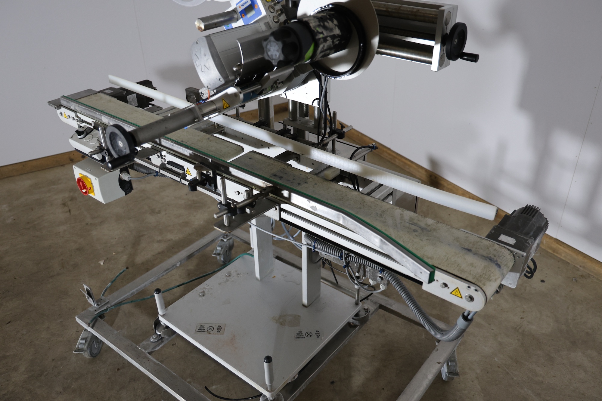 Used 2014 Herma H400 16R Labeling machine on belt