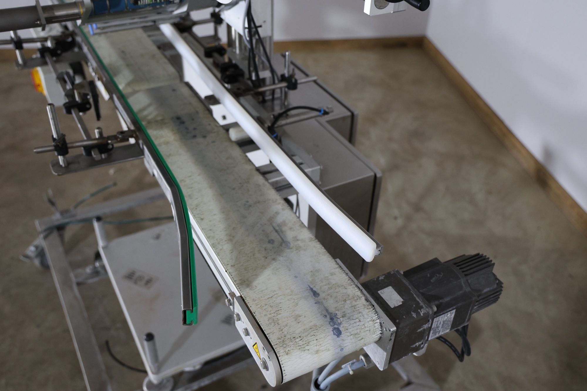 Used 2014 Herma H400 16R Labeling machine on belt