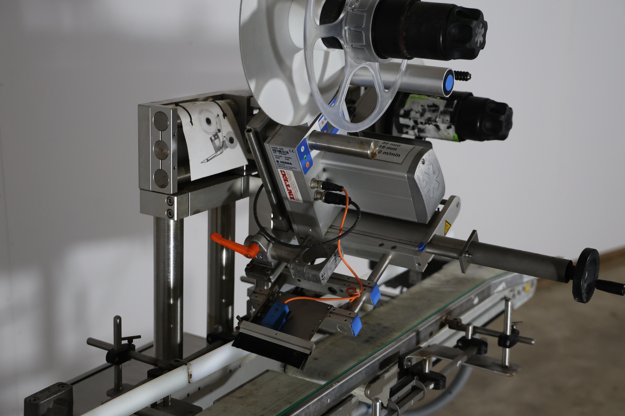 Used 2014 Herma H400 16R Labeling machine on belt