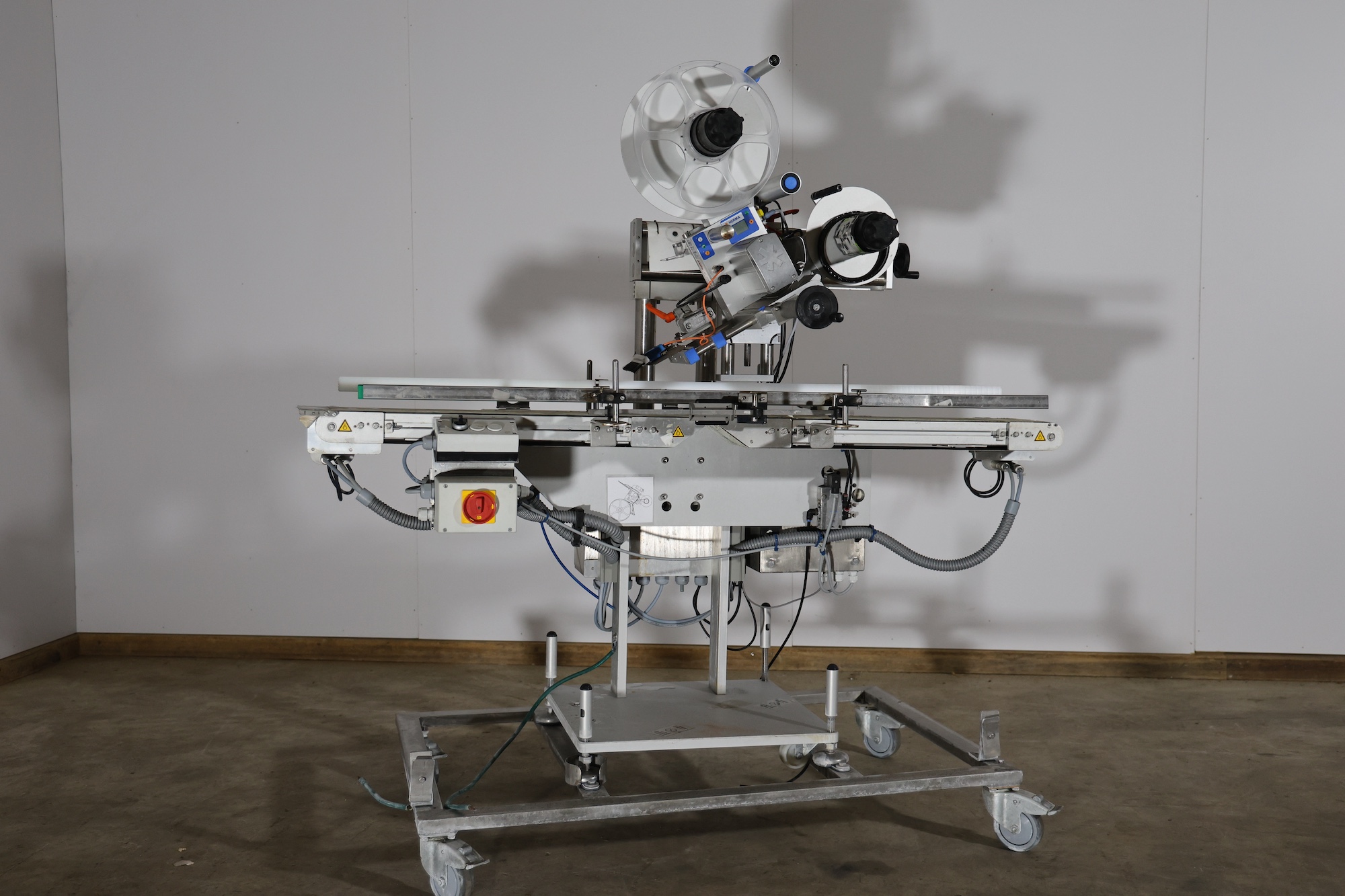 Used 2014 Herma H400 16R Labeling machine on belt