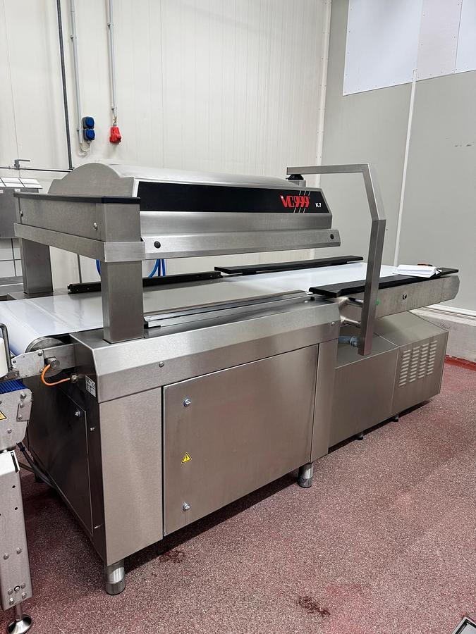 Used VC999 K7B2 conveyorized chamber vacuum packaging machine
