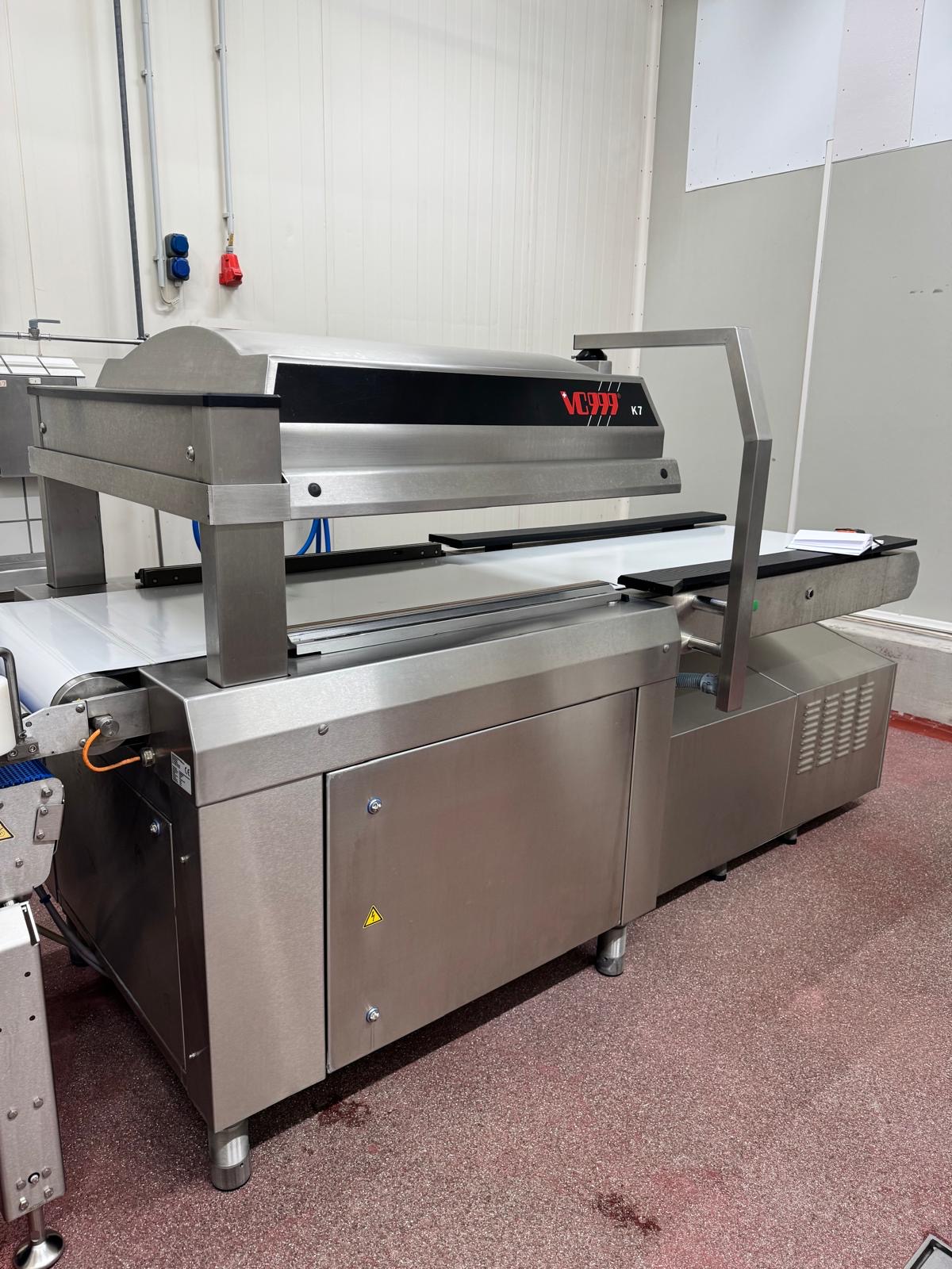 Used VC999 K7B2 conveyorized chamber vacuum packaging machine