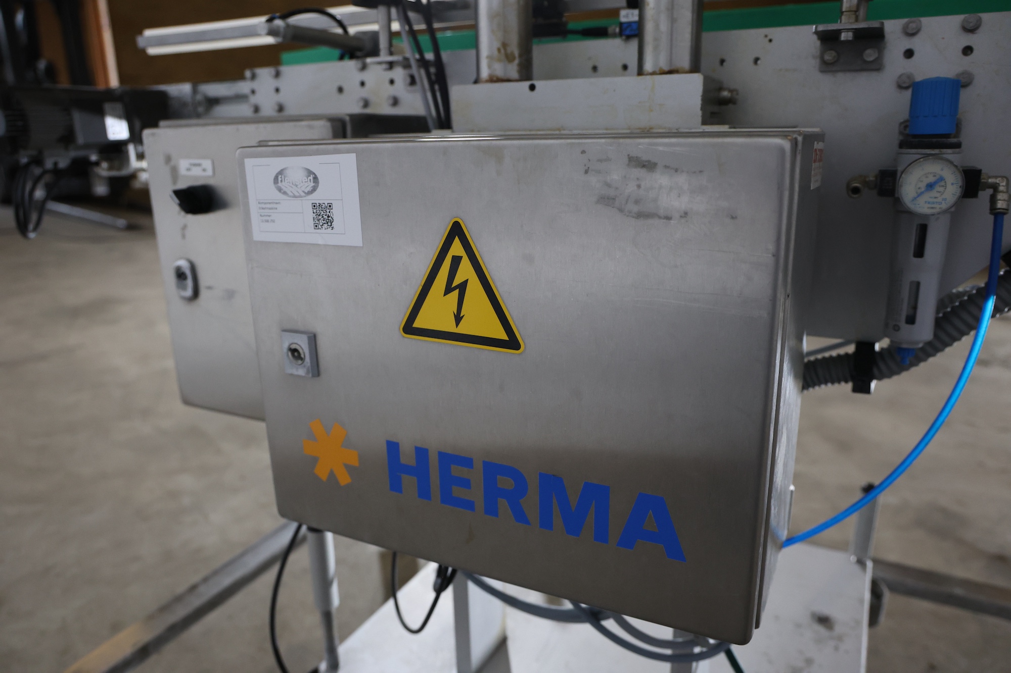 Used 2014 Herma H400 16R Labeling machine on belt