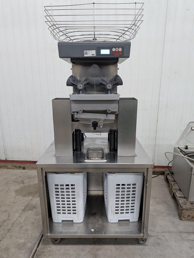 Used Zummo automatic orange juicer on stainless steel cabinet