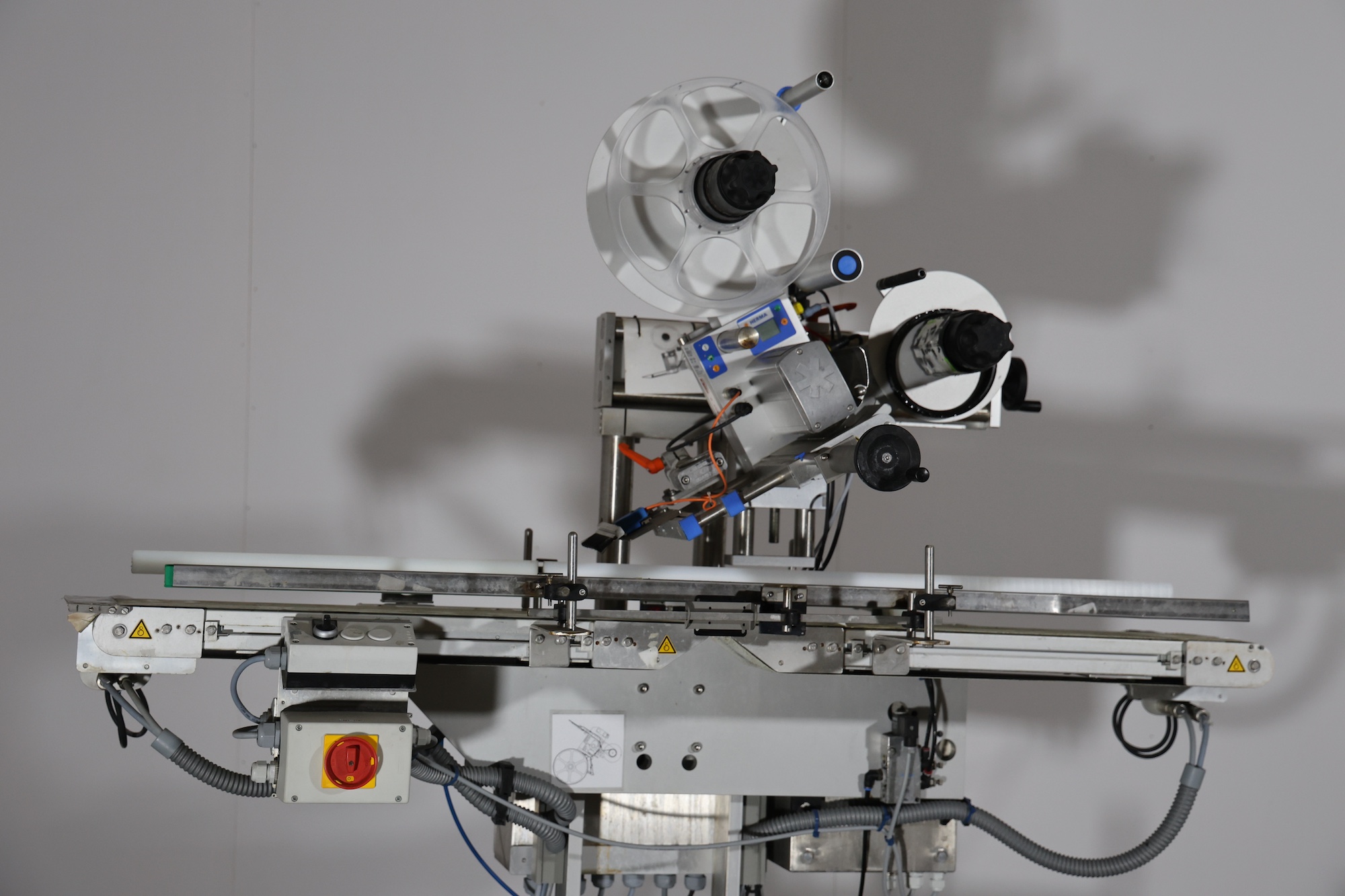 Used 2014 Herma H400 16R Labeling machine on belt