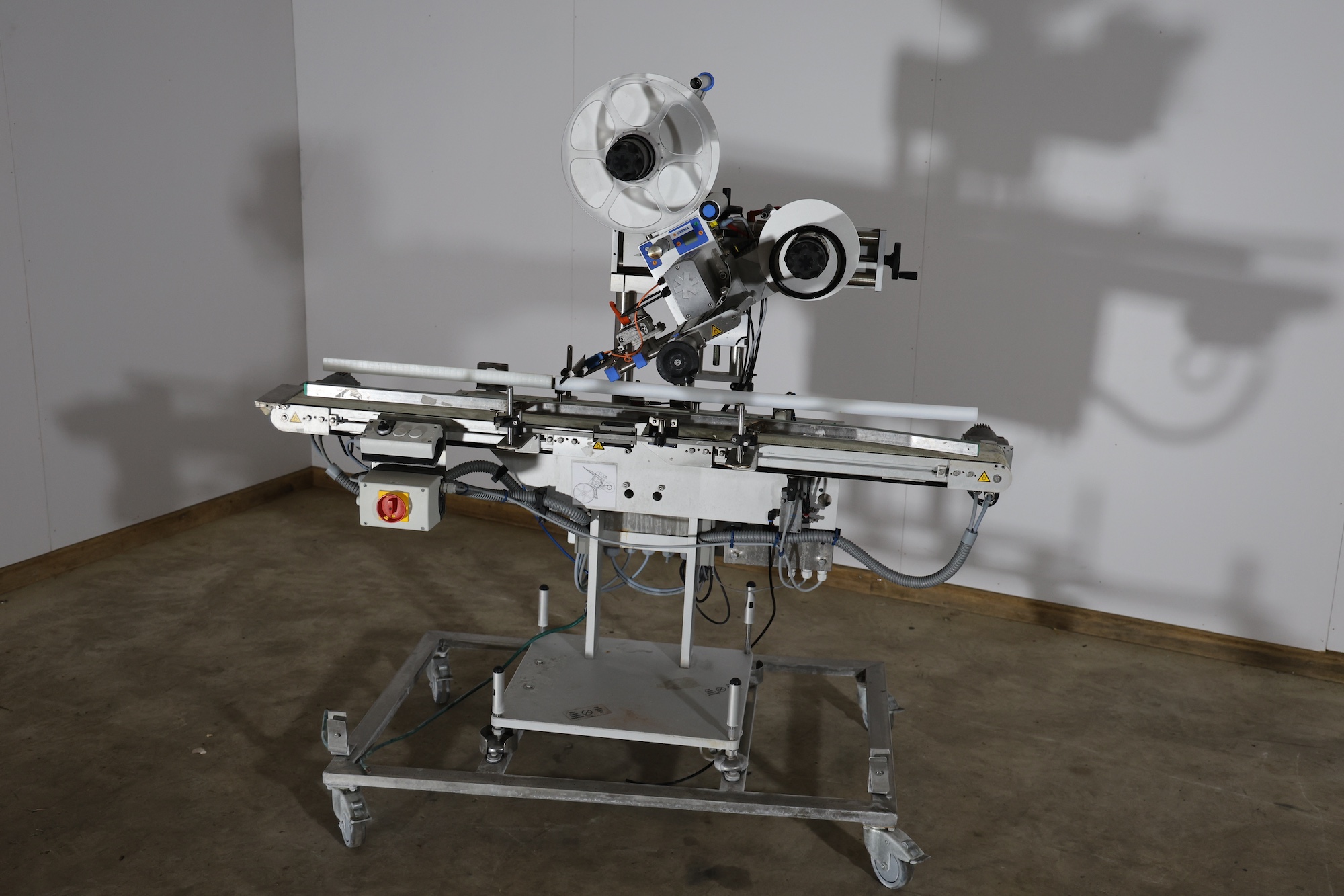 Used 2014 Herma H400 16R Labeling machine on belt