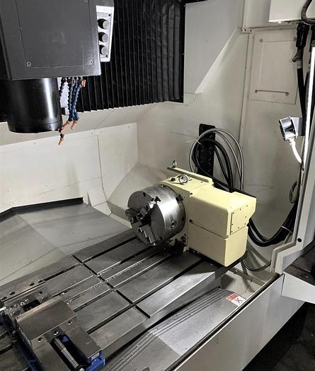 Used 2018 OKUMA GENOS M560-V CNC MACHINING CENTER WITH NIKKEN 10” ROTARY TABLE & CHUCK