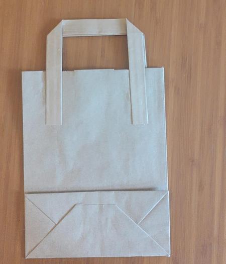 Used (visible in production) 1989 WINDMÖLLER & HÖLSCHER (W&H) T1441 - For making and attaching flat  handles to paper bags