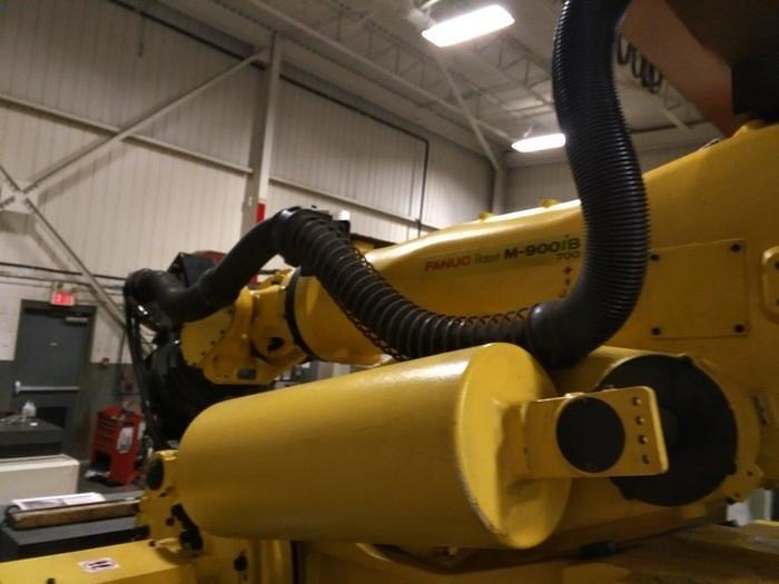 Used 2012 FANUC  M900iB/700 6 AXIS CNC ROBOT WITH R30iB CONTROLLER  & 7TH AXIS 15' LONG TRACK.