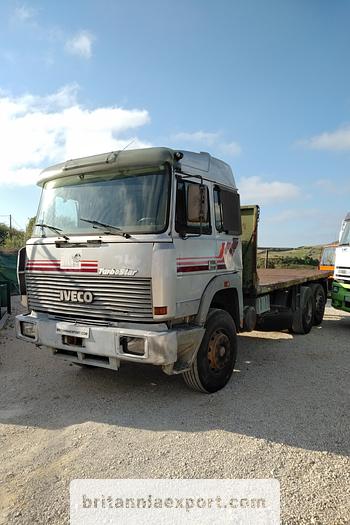 Used 1990 Iveco Turbostar 190-36 6X2 flatbed truck.