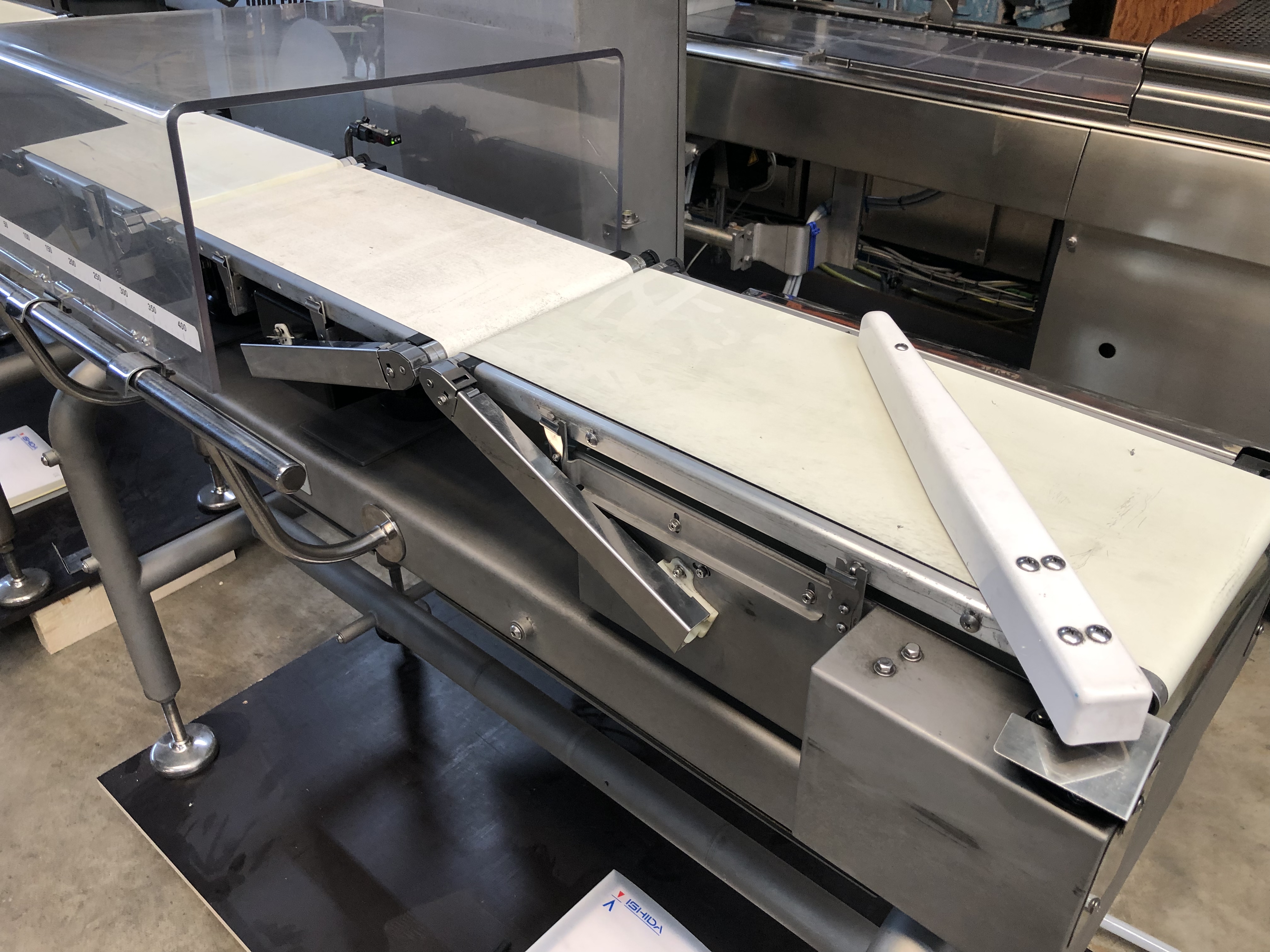 Used Ishida checkweigher with automatic reject system.
