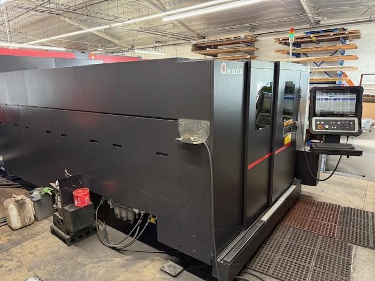 Used 2017 - 2000 Watt Amada Ensis 3015AJ Fiber Laser w/ AMS3015CL Loader