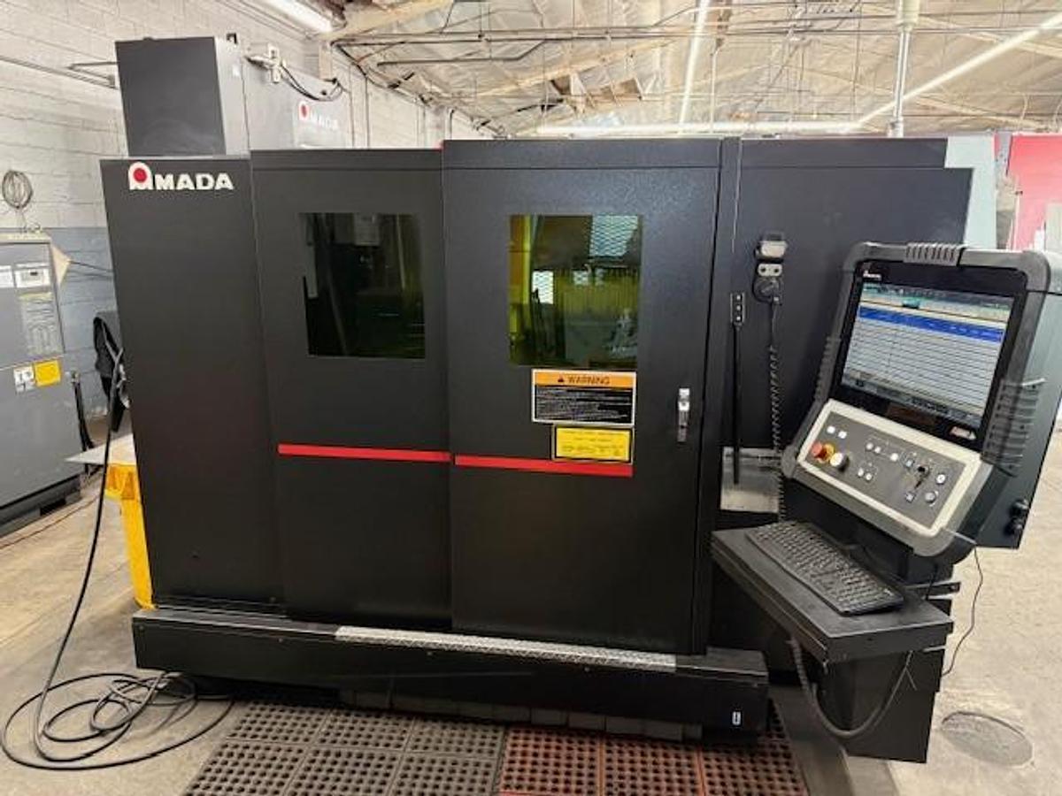 Used 2017 - 2000 Watt Amada Ensis 3015AJ Fiber Laser w/ AMS3015CL Loader