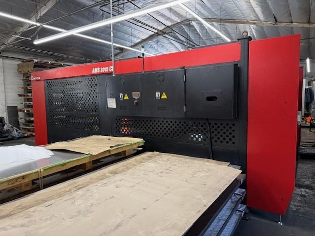 Used 2017 - 2000 Watt Amada Ensis 3015AJ Fiber Laser w/ AMS3015CL Loader
