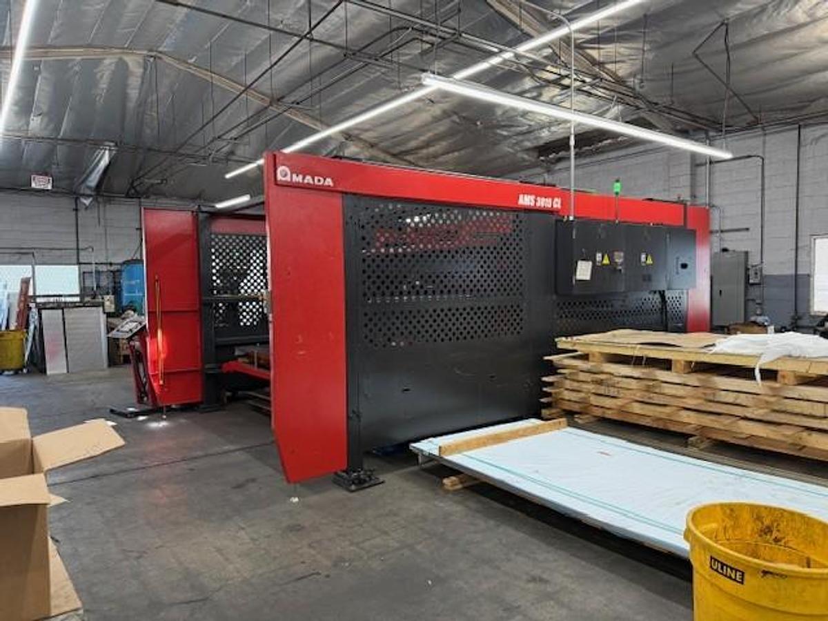 Used 2017 - 2000 Watt Amada Ensis 3015AJ Fiber Laser w/ AMS3015CL Loader