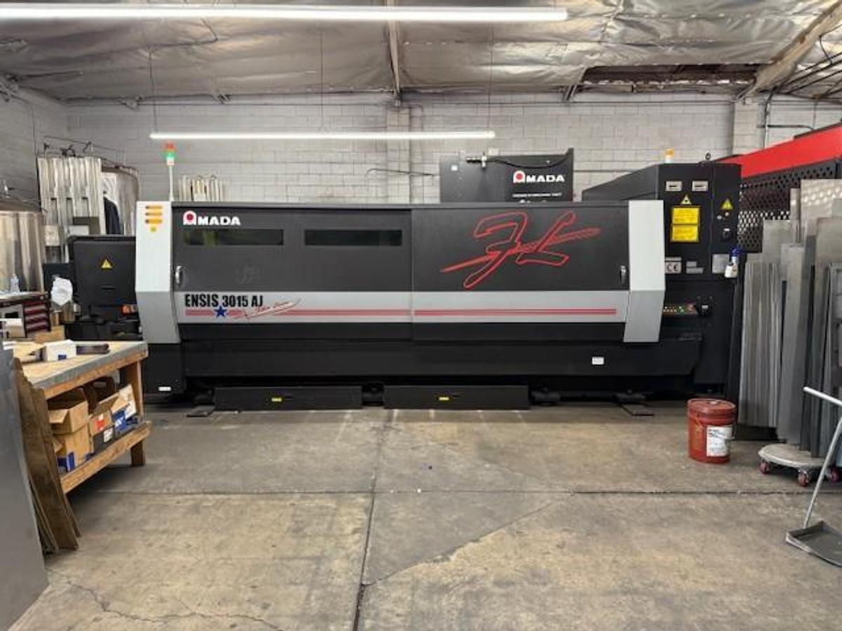 Used 2017 - 2000 Watt Amada Ensis 3015AJ Fiber Laser w/ AMS3015CL Loader