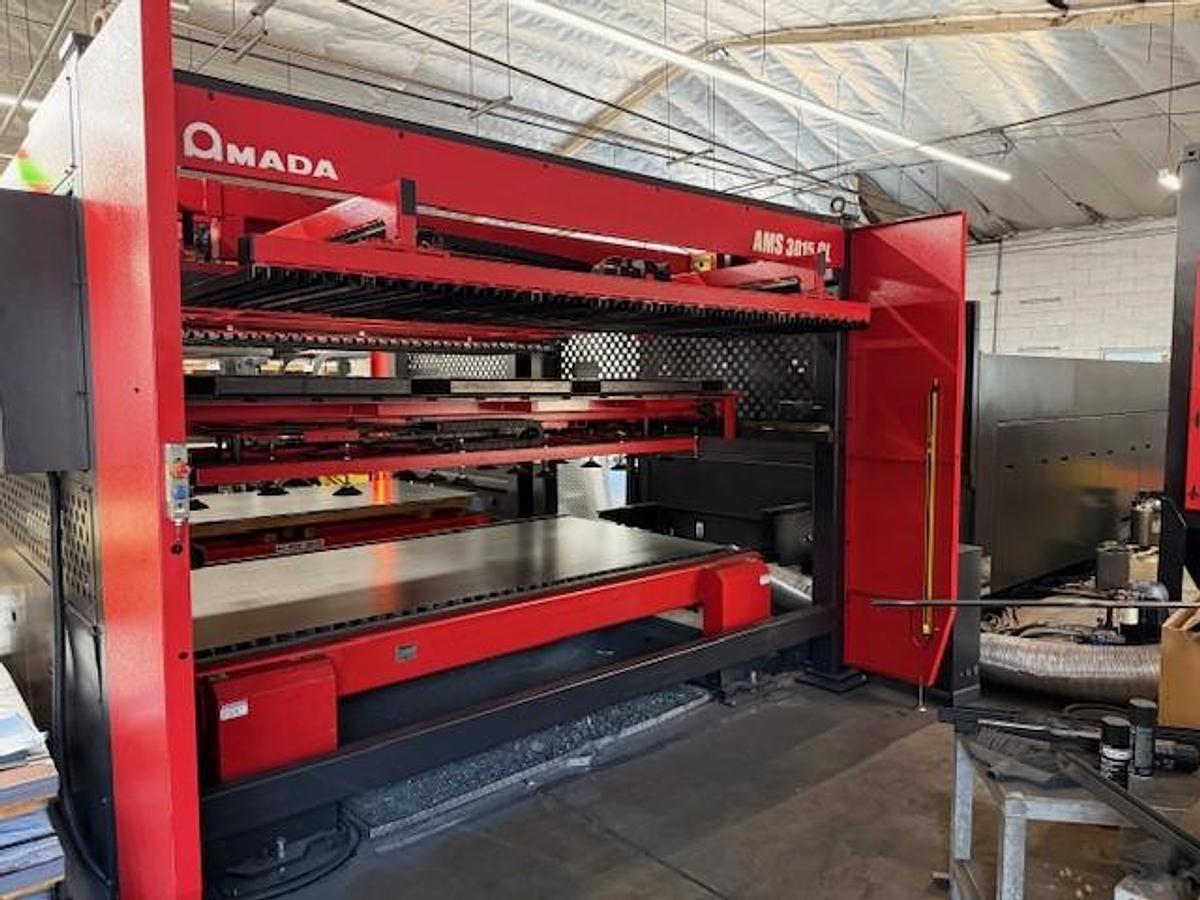 Used 2017 - 2000 Watt Amada Ensis 3015AJ Fiber Laser w/ AMS3015CL Loader