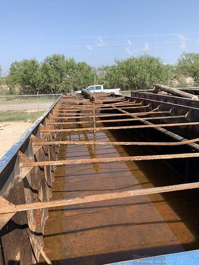 Used Open Top Workover Tank on a Rock Over Trailer