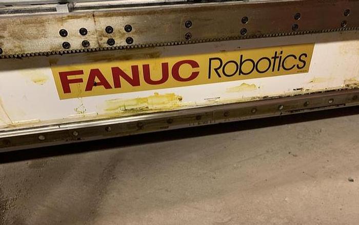 Used FANUC GANTRY ROBOT SYSTEM WITH M710iB/70T ROBOT 8' TALL X 10,200 MM TRAVEL RJ3iB CONTROLLER
