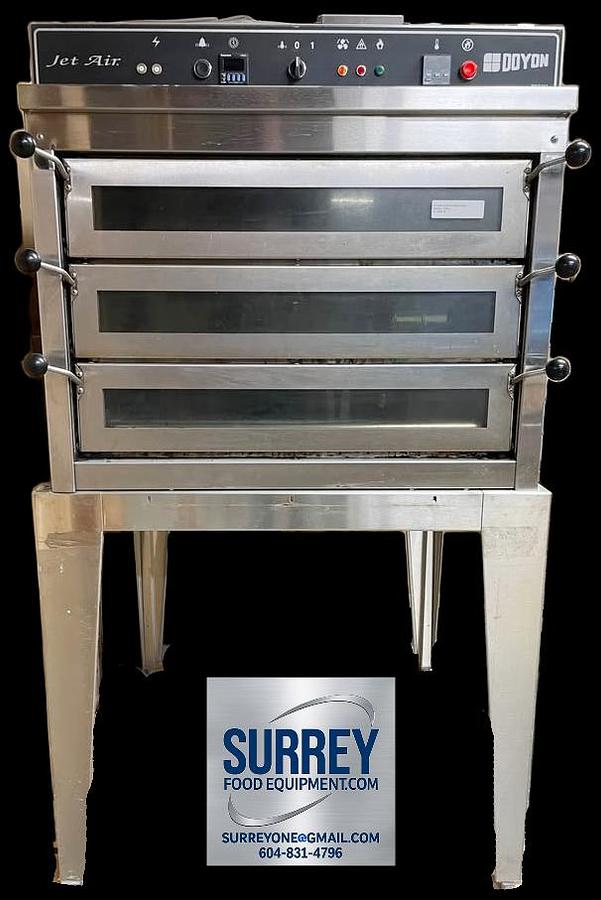 Used Doyon PIZ3G triple deck gas pizza oven