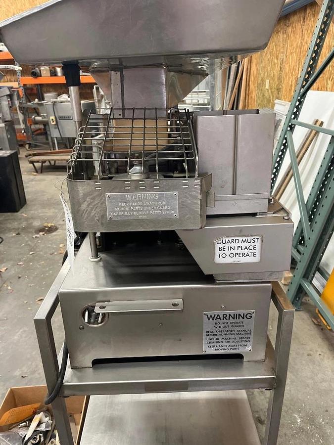 Used Hollymatic Super 54 patty machine with mold plates and accessories