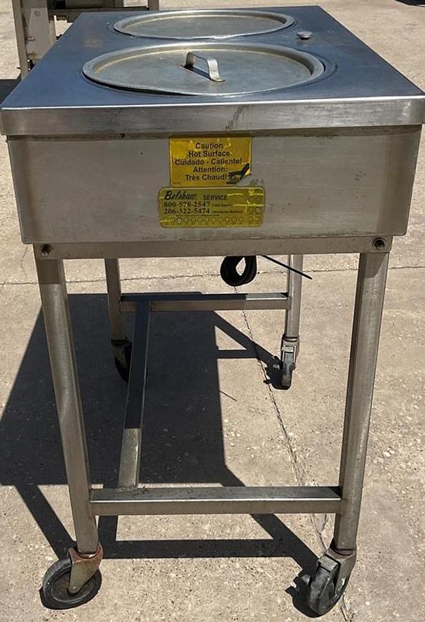 Used Belshaw icing warmer on Casters