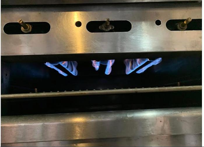 Used Wolf combo Gas range - 2 ovens - 6 burners - 24" flat top grill with broiler