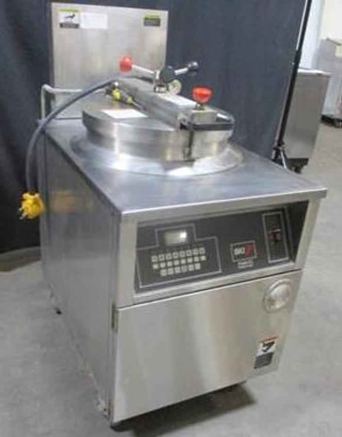 Used BKI 75lb Electric Pressure Fryer With Pull Out Grease Filter.