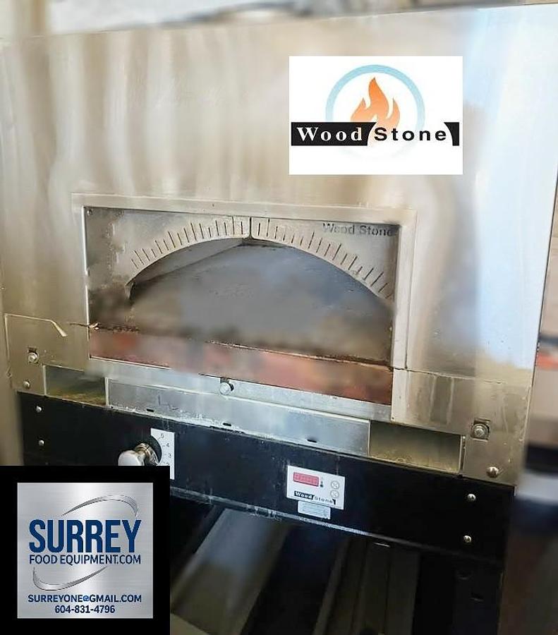 Used Woodstone Bistro Gas or Wood Pizza Oven - 18 months old - warranty