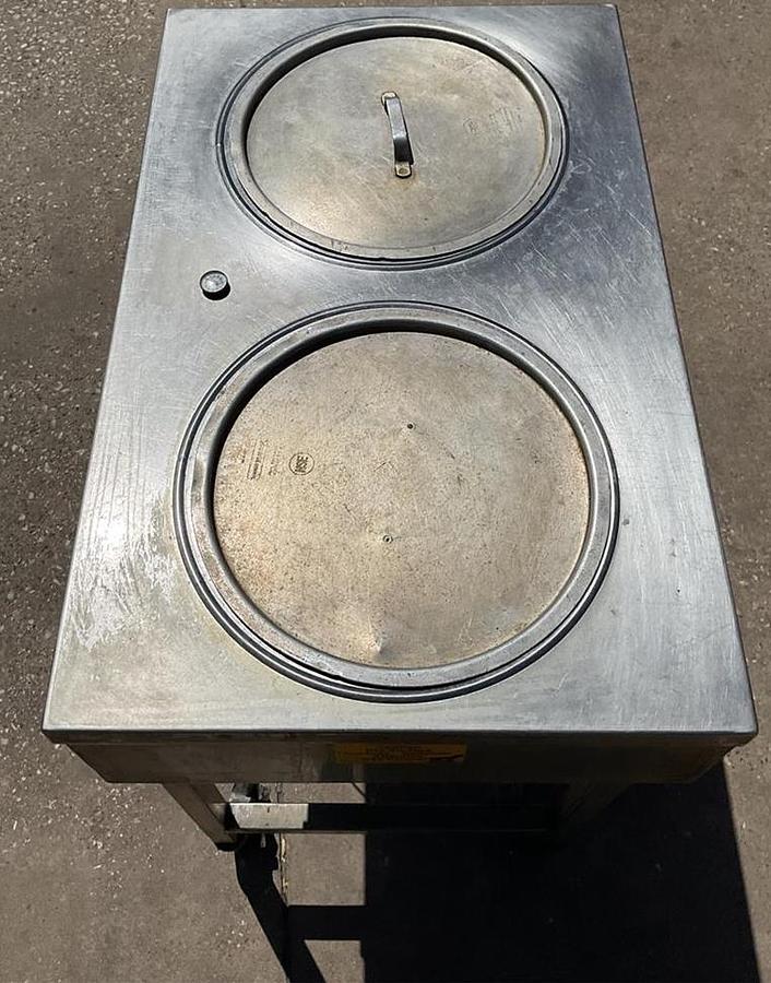 Used Belshaw icing warmer on Casters