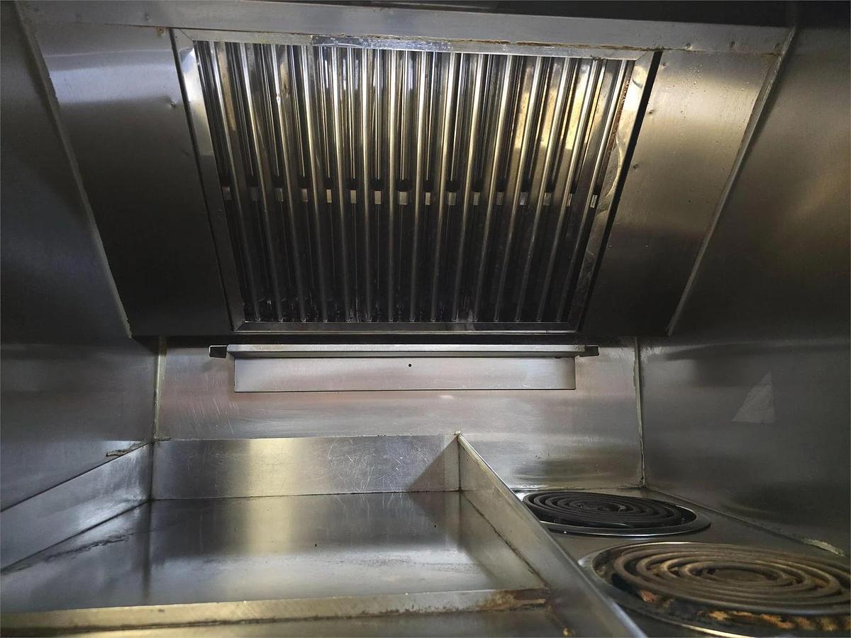 Used Wells Ventless cooking system - 2 burner with flat top grill and oven below