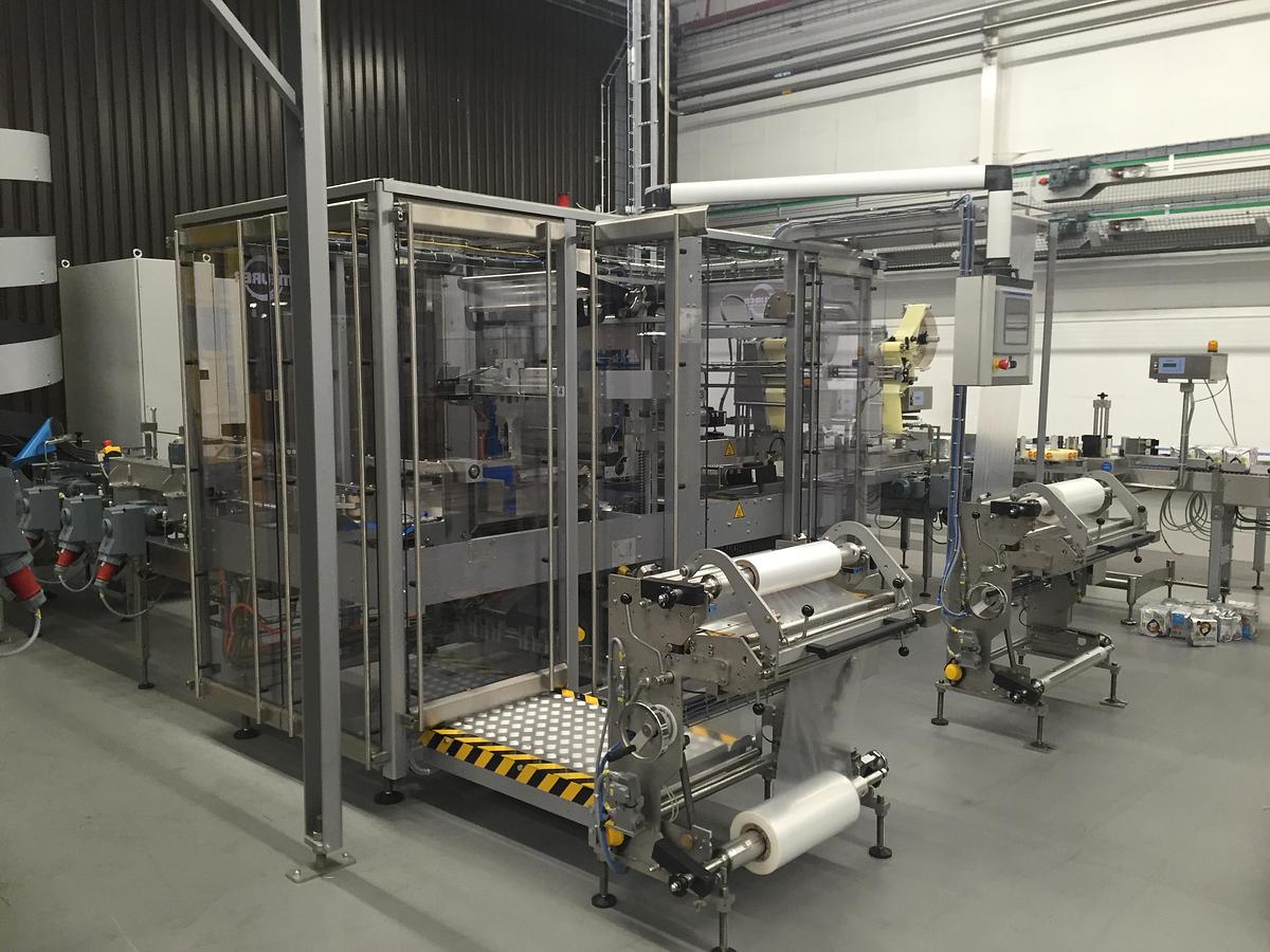 Used - CMB 600 Shrink Wrapping Machine and StraPack RQ-8X Automatic Strapping Machine for Sale