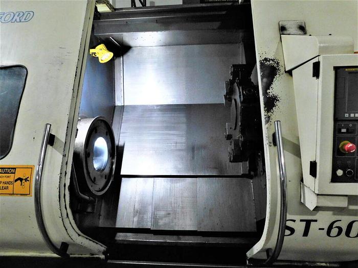 Used Johnford ST-60GX+CF 31″x54″ CNC Slant Bed Turning Center Fanuc I0-TD with Tooling